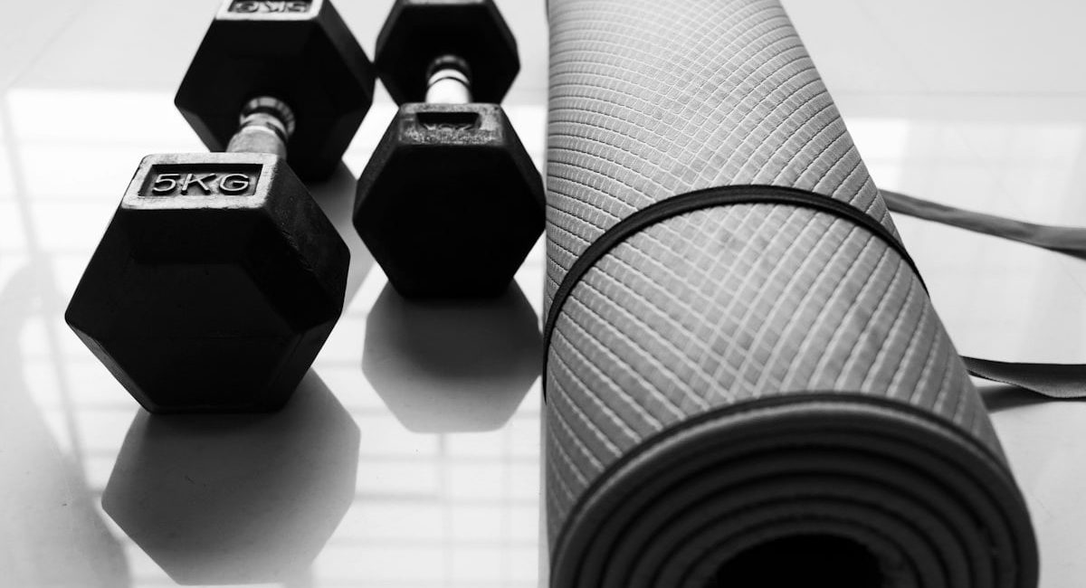 Two Dumbbells and exercise mattress on the floor